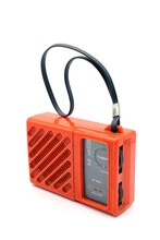 Vintage Orange Portable Transistor Radio, Isolated On A White Background