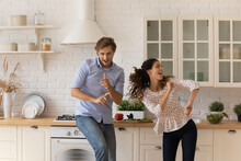 Cheery Couple Listen Favourite Song, Enjoy Quality Sound Music Dance In Modern Renovated Kitchen Celebrate Moving Day, Life Event, Having Festive Mood Spend Weekend At Home. Hobby, Lifestyle Concept