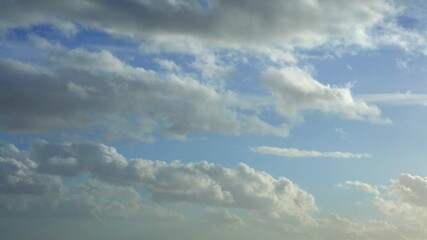 Wall Mural - Cumulus clouds with blue sky on a sunny day of summer. Beautiful cloudscape as nature background panorama. Wonderful weather of natural daylight with white cloud floating