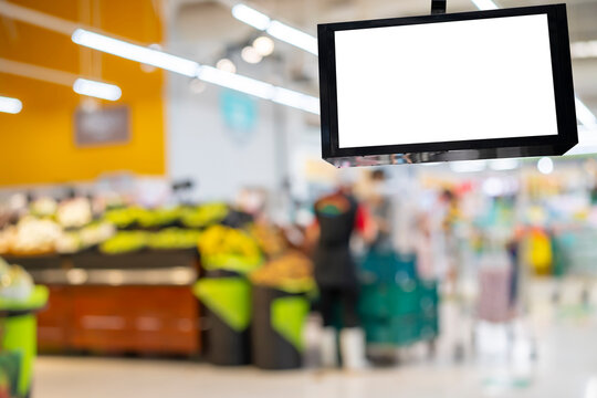 lcd television screen in the supermarket blur people at cashier.