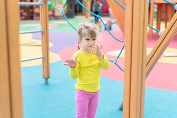 cute baby playing and climbing on the playground