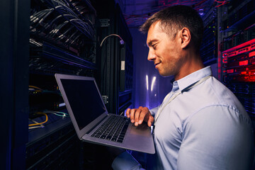 Wall Mural - Smiling pleased system administrator checking server performance