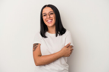 Young caucasian woman with one arm isolated on white background laughing and having fun.