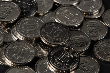 Ukrainian hryvnias coins. Background from Ukrainian coins 10 hryvnia. Money and finances.