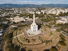 Monument To The Heroes Of The Restoration Surrounded By Buildings In The Dominican Republic