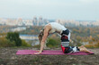 © Oleh - woman doing stretching exercise in the park