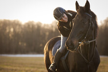 Female Horse Rider Riding Outdoors On Her Lovely Horse