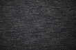 Gray fabric texture top view. Fragment of clothing from cotton background. The fabric is soft, dark gray. Textile grunge background.