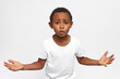 © Anatoliy Karlyuk - Horizontal portrait of cool African American boy arguing, gesticulating while talking emotionally, reaching hands up, proving he’s right, giving arguments. Body language, gestures, emotions