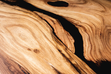 Wall Mural - Style wooden countertop slab, saw cut wood treated with varnish close-up on black. Isolate.
