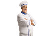 Mature male chef in a uniform posing with crossed arms