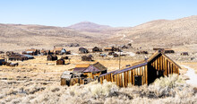 Ghost Town Of Bodie In California - Travel Destination Concept With Wide Angle View Of Abandoned Place In Western United States Of America - Warm Bright Filter