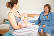 © oksix - Breastfeeding consultant supports young mother to overcome problems