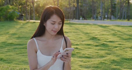 Canvas Print - Woman use of cellphone at park