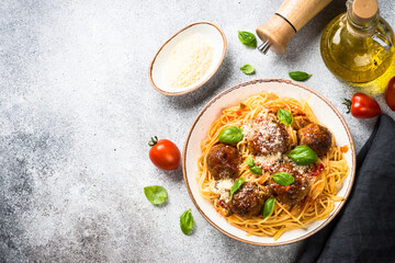 Sticker - Pasta with Meatballs in tomato sauce, basil and parmesan on stone table. Top view with copy space.