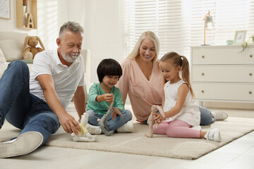 Wall Mural - Happy grandparents and their grandchildren spending time together at home