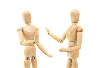 two wooden figures of people communicate