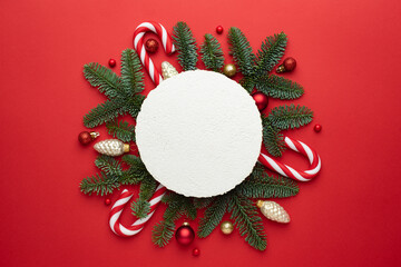 Wall Mural - festive christmas background with a frame made of decorated fir branches
