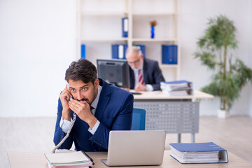 Two male colleagues working in the office