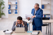 © Elnur - Two male colleagues working in the office