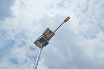 LED street light with solar cell panel on blue sky