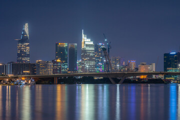 Bitexco Financial Tower building, buildings, roads, Thu Thiem 2 bridge and Saigon river in Ho Chi Minh city - This city is a popular tourist destination of Vietnam