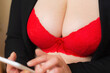 © ARVD73 - Busty big breasts secretary in red bra online flirt on the phone, desire.Sexy Flirt online concept.