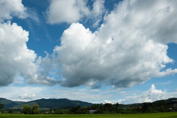 Wall Mural - The white clouds have a strange shape and moutain.The sky and the open space have mountains below.Clouds floating above the mountains.