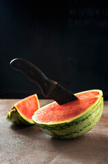 Wall Mural - Fresh sliced watermelon on dark background