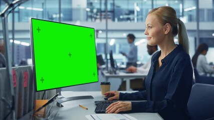 Leinwandbilder - Diverse Modern Office: Confident Businesswoman Using Desktop Computer with Green Screen Mock Up Display. Manager Working on e-Commerce Customer Support, Project Marketing