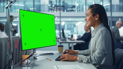 Leinwandbilder - Diverse Corporate Office: Beautiful Black Female IT Technician Using Desktop Computer with Green Chroma Key Screen. Creative Software Engineer Work on eCommerce Project Marketing, Development