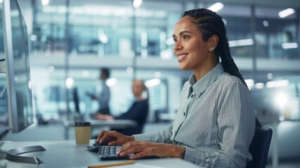 Corporate Office: Black Female IT Technician Using Desktop Computer, Uses Big Data Statistics, Graphs. Smiling Creative Software Engineer Work on eCommerce Project Marketing, Development. Zoom in Shot