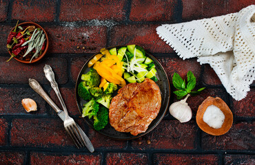 Sticker - plate of steak with vegetables on plate, top view