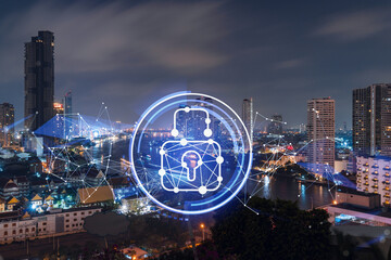 Glowing Padlock hologram, night panoramic city view of Bangkok, Southeast Asia. The concept of cyber security to protect companies. Double exposure.