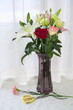 Close-up of lilies, red roses, white roses, carnations; scissors, floristry
