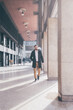 © Eugenio Marongiu - Young bearded caucasian elegant businessman relaxing walking outdoors smoking cigarettes