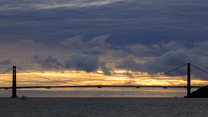 Canvas Print - Dramatic Sunset over the Golden Gate Bridge via Cruise Boat