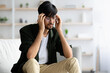 © Prostock-studio - Indian guy touching his head, suffering from migraine, copy space