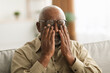 © Prostock-studio - Senior African Man Rubbing Eyes Wearing Eyeglasses Having Glaucoma Indoors