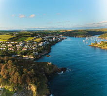 Aerial View Of A Small Harbour At Sunset In A Beautiful Bay Near St. Catherine Castle In Fowey, Cornwall, England.