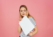 © SHOTPRIME STUDIO - blonde woman in a striped T-shirt with a white sheet in hand banner Copy space
