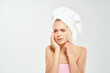 © SHOTPRIME STUDIO - woman with a towel on my head facial skin problems light background