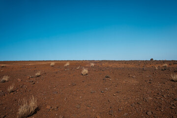 Sticker - stone desert landscape with blue sky background