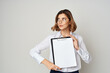 © SHOTPRIME STUDIO - Businesswoman with folder for papers Professional studio posing