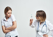 © SHOTPRIME STUDIO - nurse syringe in hand treatment isolated background