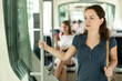 © JackF - Portrait of focused brunette during trip in public transport in sunny summer day..