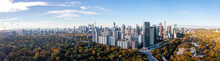 Drone Panorama Of Toronto Skyline  With Fall Leaafs Surrounding The Cityscape