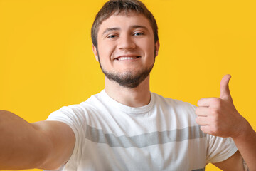 Sticker - Cool man taking selfie on color background