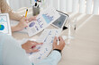 © DragonImages - Managers of sales department discussing results of work and comparing reports with various charts at meeting