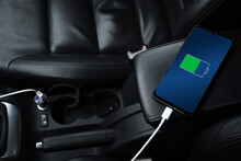 Mobile Phone ,smartphone, Cellphone Is Charged ,charge Battery With Usb Charger In The Inside Of Car. Modern Black Car Interior